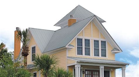 yellow house with silver metal roof|yellow metal roof ideas.